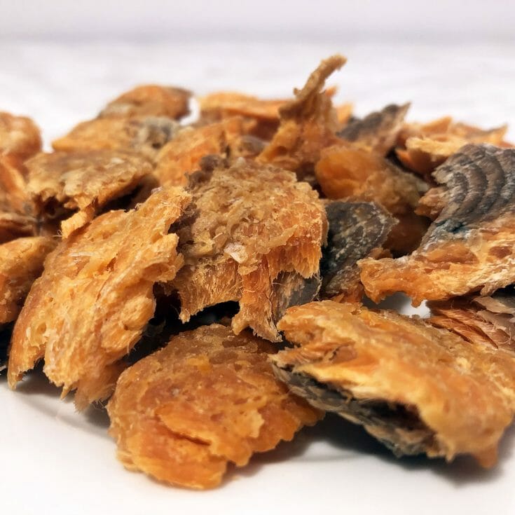 a close up of dehydrated trout jerky pieces
