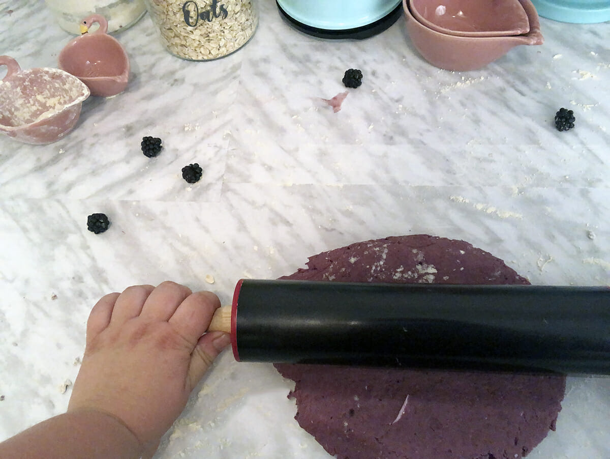 using a rolling pin to roll out dough for homemade dog treats