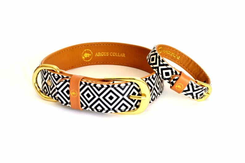 a matching brown leather collar and cuff bracelet with custom black and white diamond geometric fabric accent.